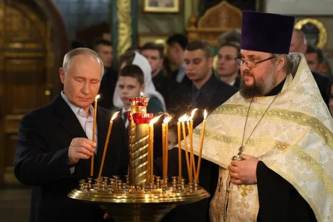President Vladimir Putin in a church on Poklonnaya Hill in Moscow