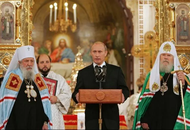 Vladimir Putin at the signing of the Act of Canonical Communion between the Russian Orthodox Church and ROCOR.
