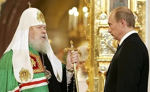 Le patriarche Alexis II et Vladimir Poutine.